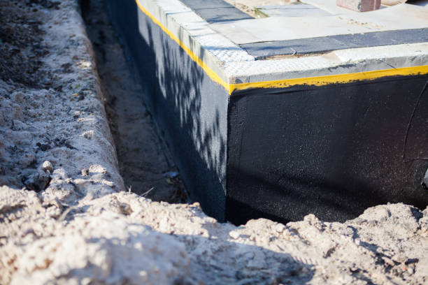 Professional Waterproofing technician working in Hudson, WI